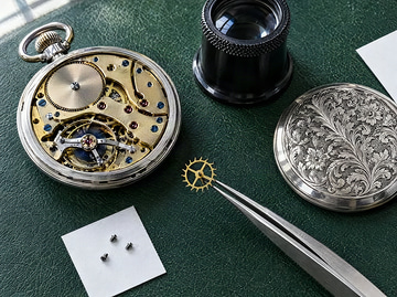 AuraSR v2 sample: A 512x383 JPEG of a watchmaker's bench upscaled 4x to 2048x1532, no tile seams