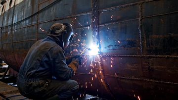 Convert Video sample: Converted: a welder's arc showering sparks down a shipyard hull, re-encoded from MOV to MP4.