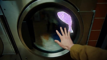 Imagera Hermes Spicy (Reference) sample: A laundromat at night with hand-drawn neon doodles animated over the footage — a glowing hand, a cloth arcing into a machine, arrows across a vending panel, then the room redrawn as a starfield.