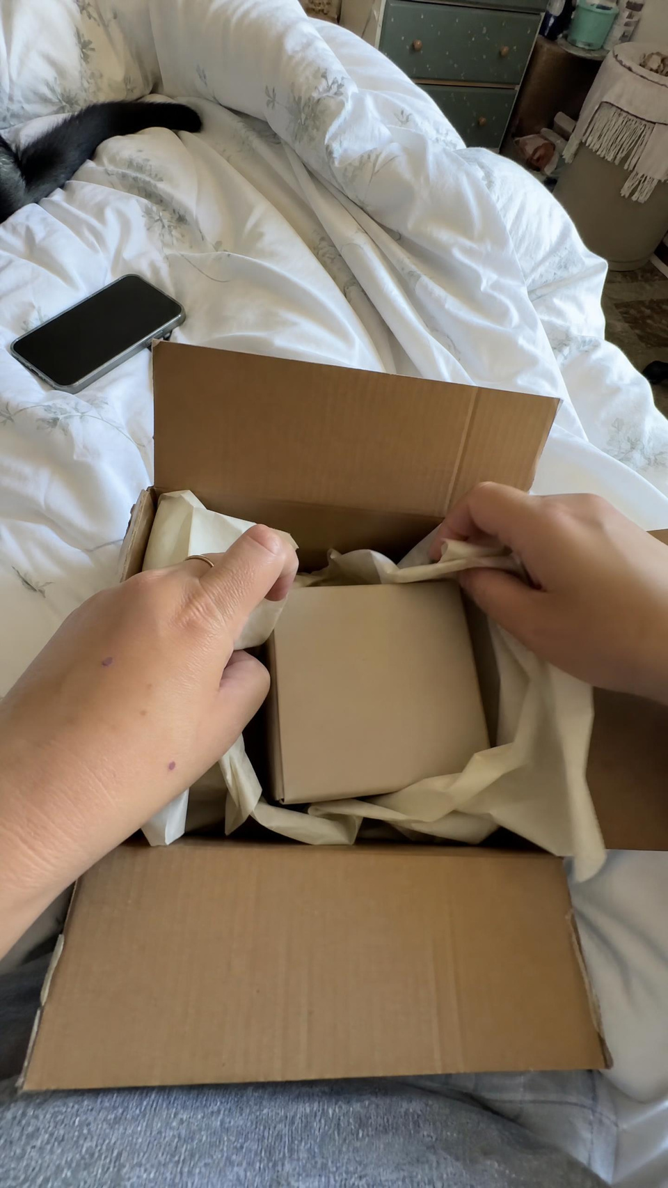 An unboxing on the bed