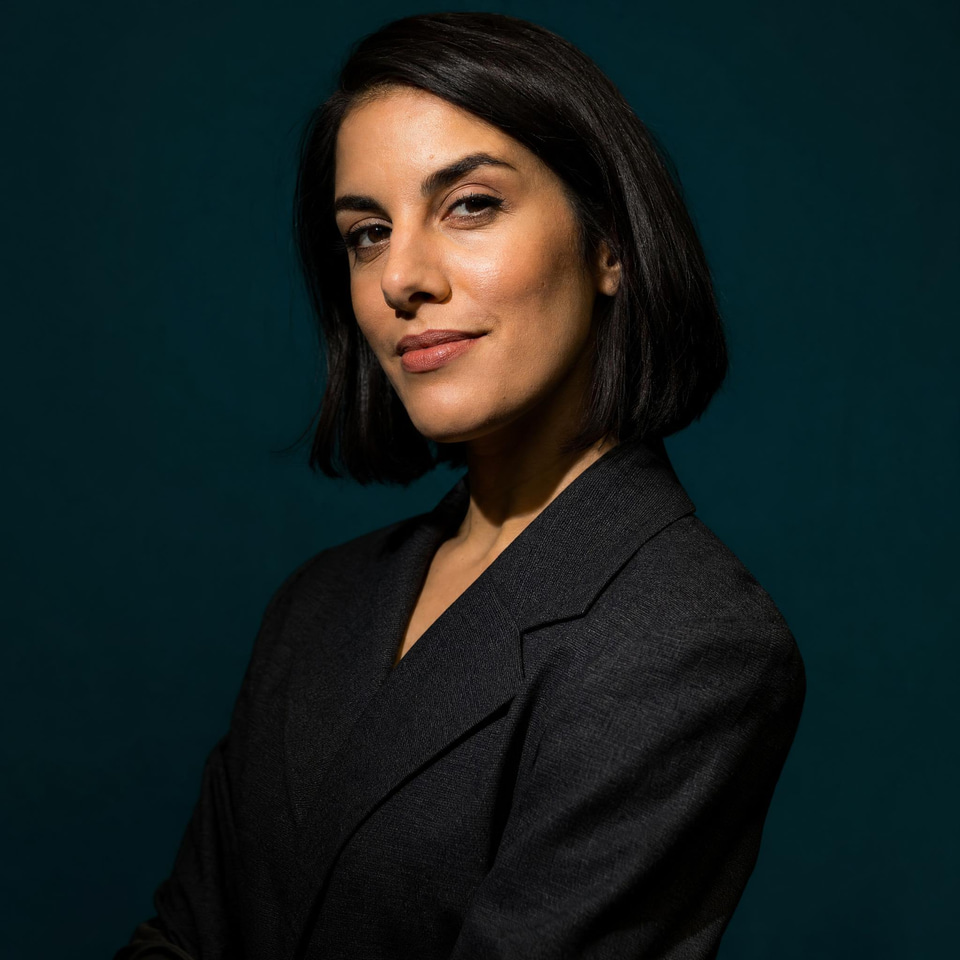 A polished studio headshot