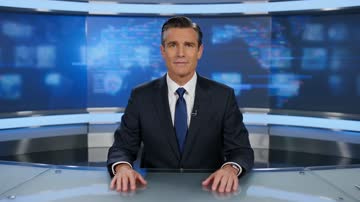 HappyHorse 1.1 sample: A newsreader at a glass desk delivers a short studio bulletin