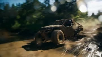 Veo 3.1 sample: A vehicle tears through mud and spray on a forest track